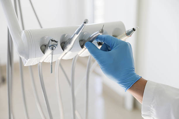 Professional Emergency Dentist technician working in Okemos, MI